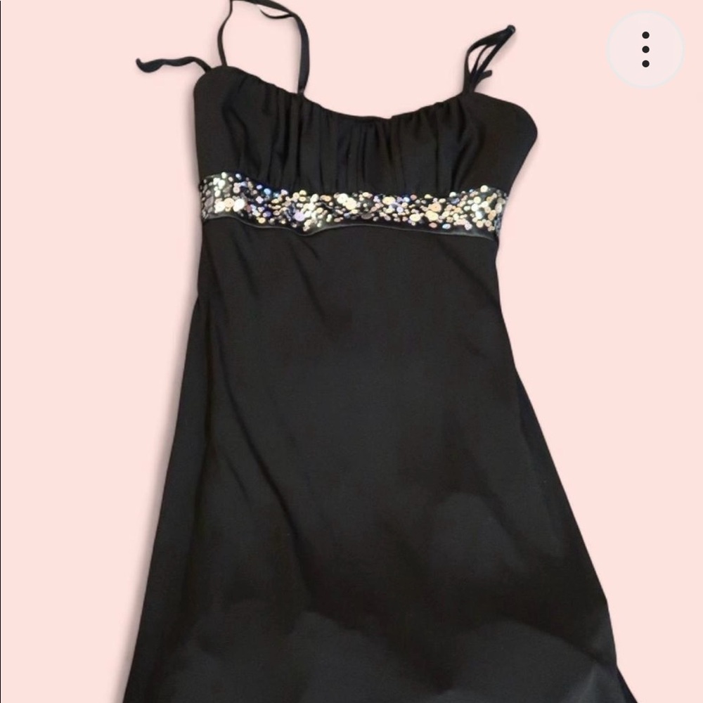 Black midi dress with sequins, tulle, and adjustable straps.
